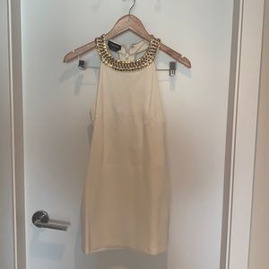 BEBE gold studded white mini dress